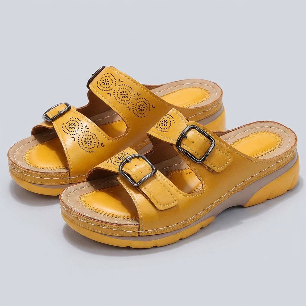 Yellow Tammy Bradley buckle platform slide sandals for women displayed in a studio setting.