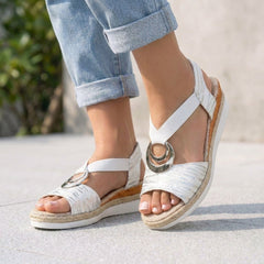 White Tammy Bradley peep-toe wedge sandals for women with open toes and ankle straps, stylish and comfortable summer footwear.