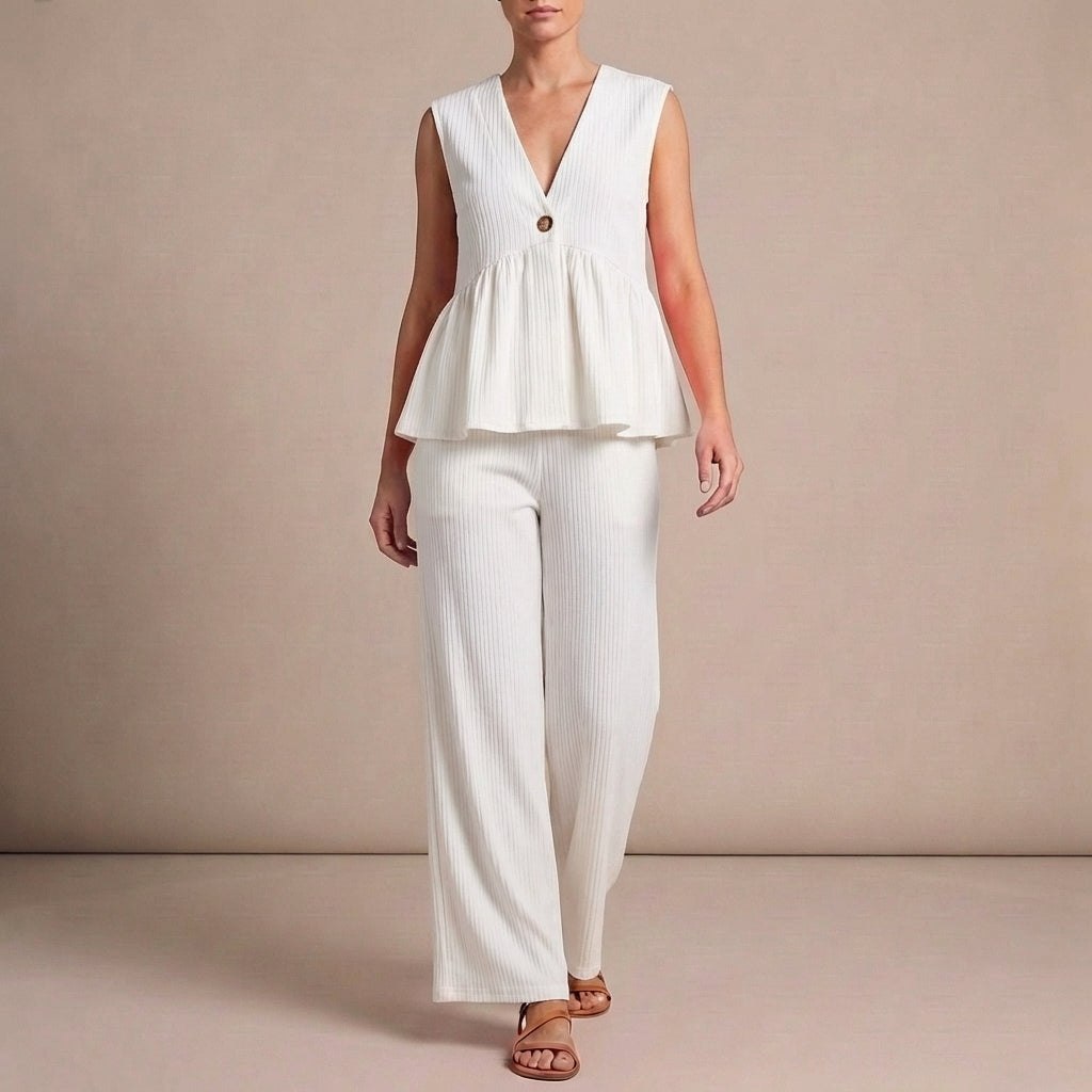 White women's V-neck wide-leg co-ord set by Tammy Bradley, featuring a stylish two-piece outfit with flowing pants and a V-neck top.